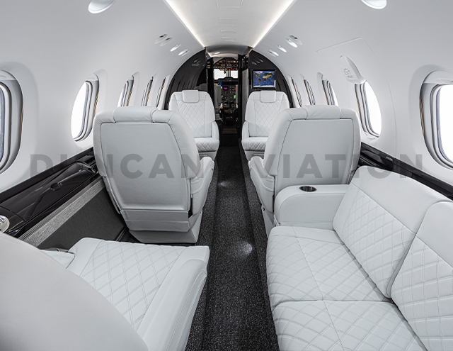 White leather club seats and divan in refurbished Hawker 800